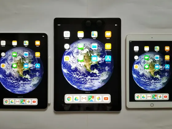 Three iPad tablets of different sizes side by side