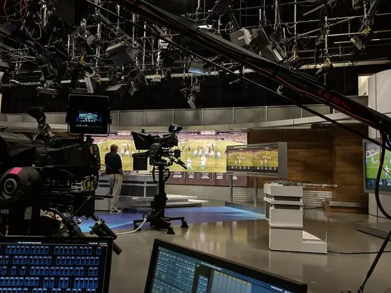Television sports studio with cameras and lighting rig